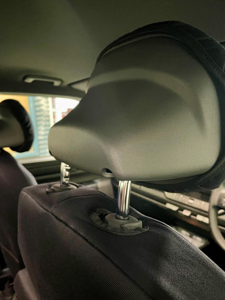 Car interior showing close up of head rest area.