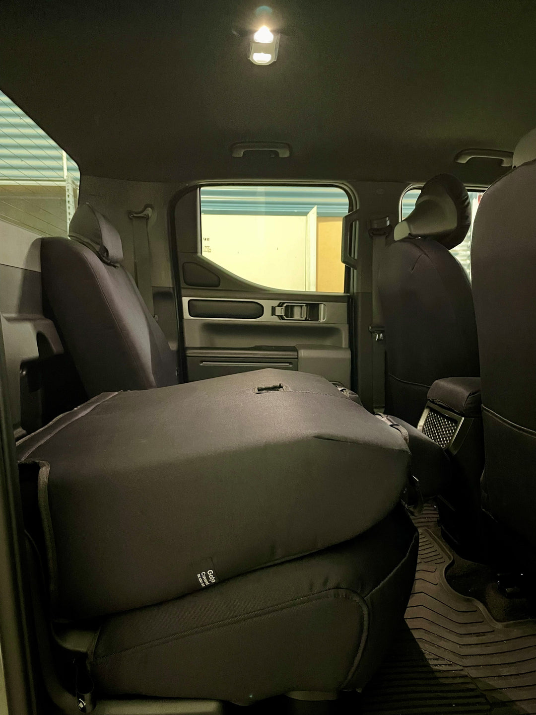 kia tasman rear 60/40 split seat folded down.